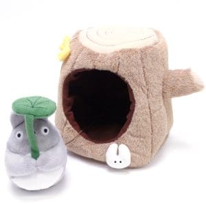 Studio Ghibli Medium-Sized Plush of Totoro with Stump House, capturing the charm of the beloved character in a whimsical setting.